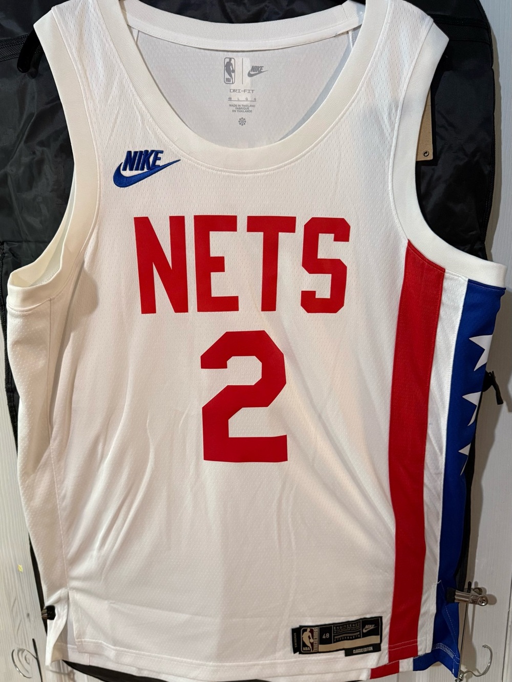 Nike White Basketball Jersey with Red and Blue Accents, Number 2